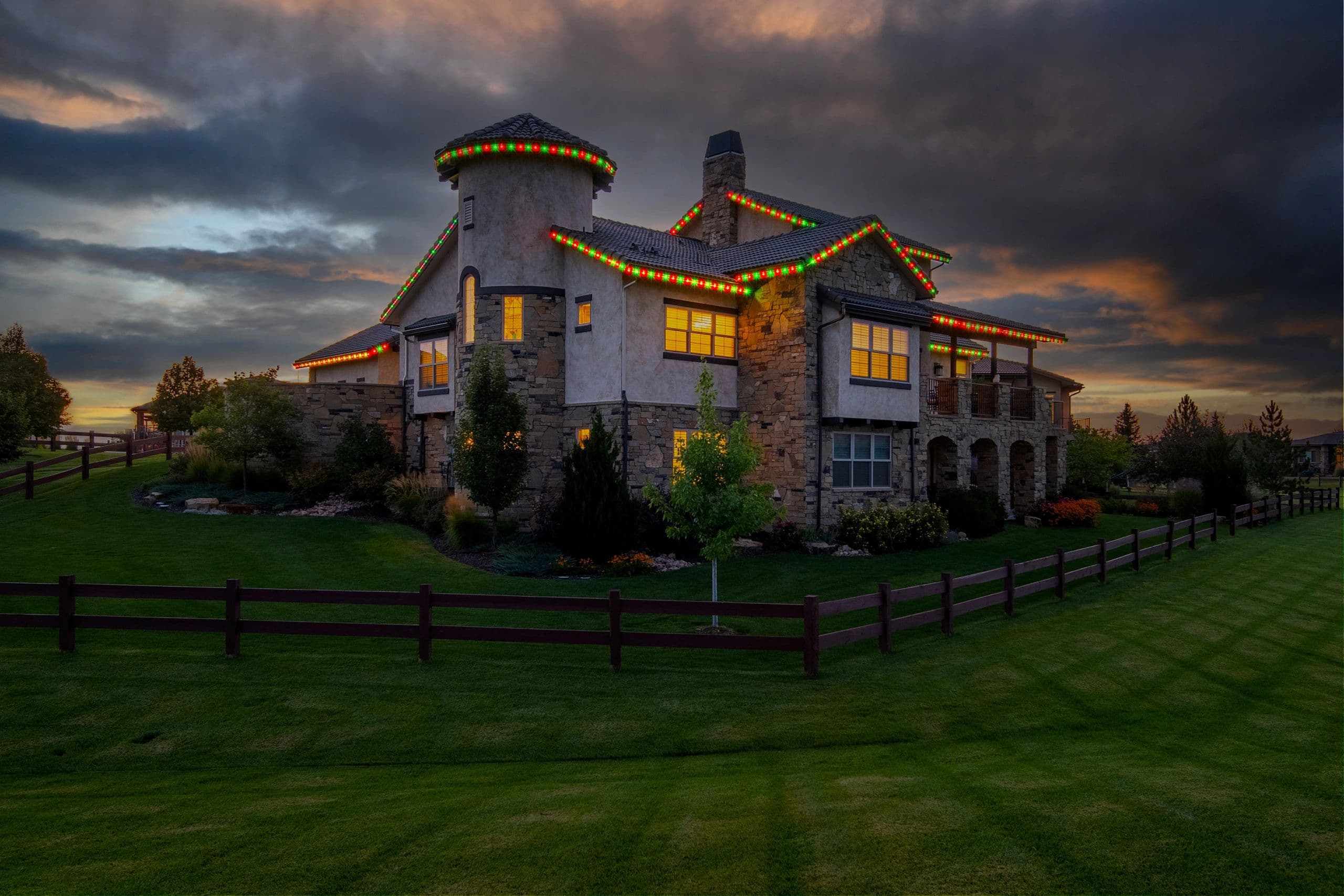 Estate with multicolor permanent roofline lighting