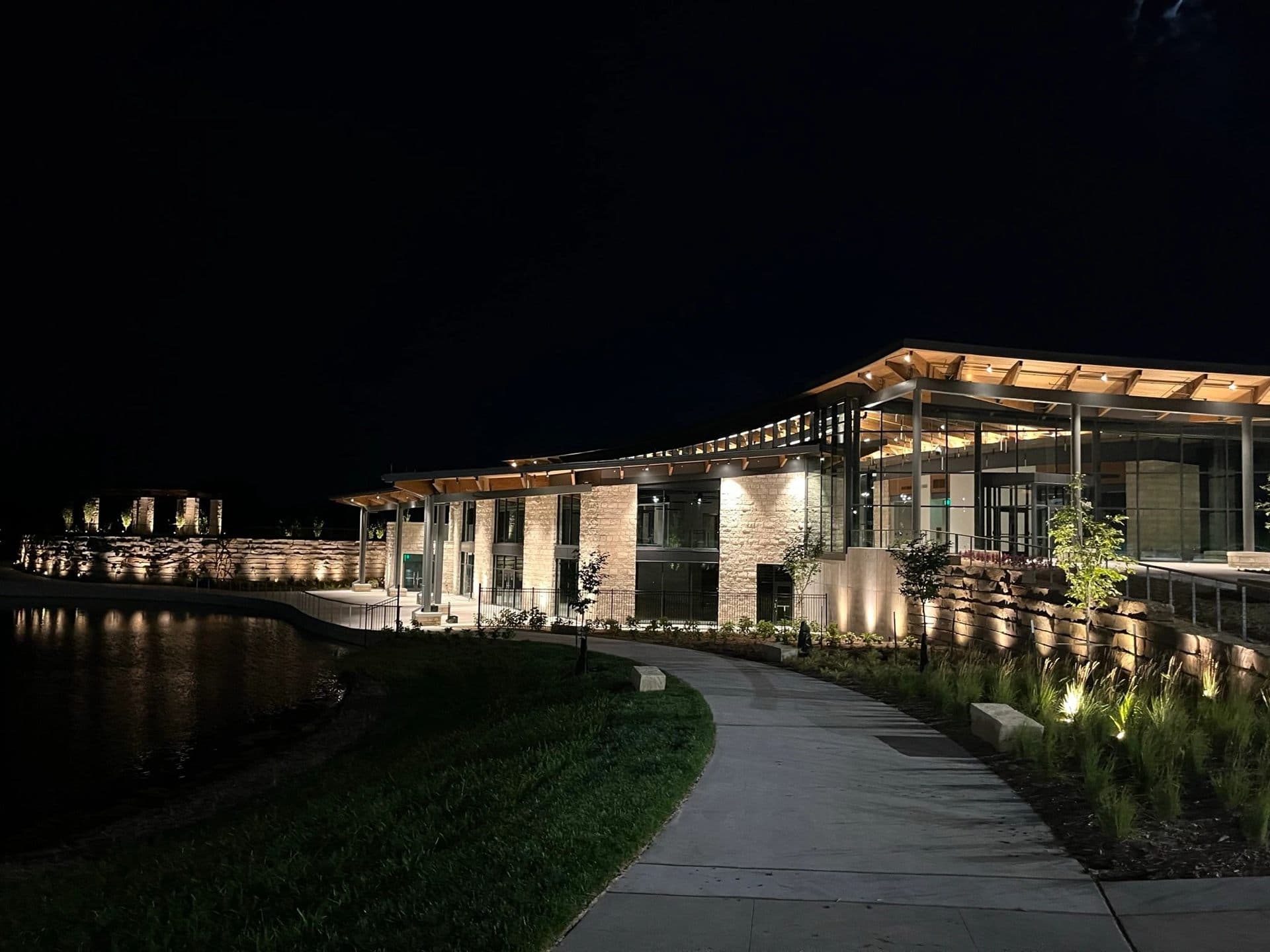 Modern building with architectural outdoor lighting at night in Kansas City